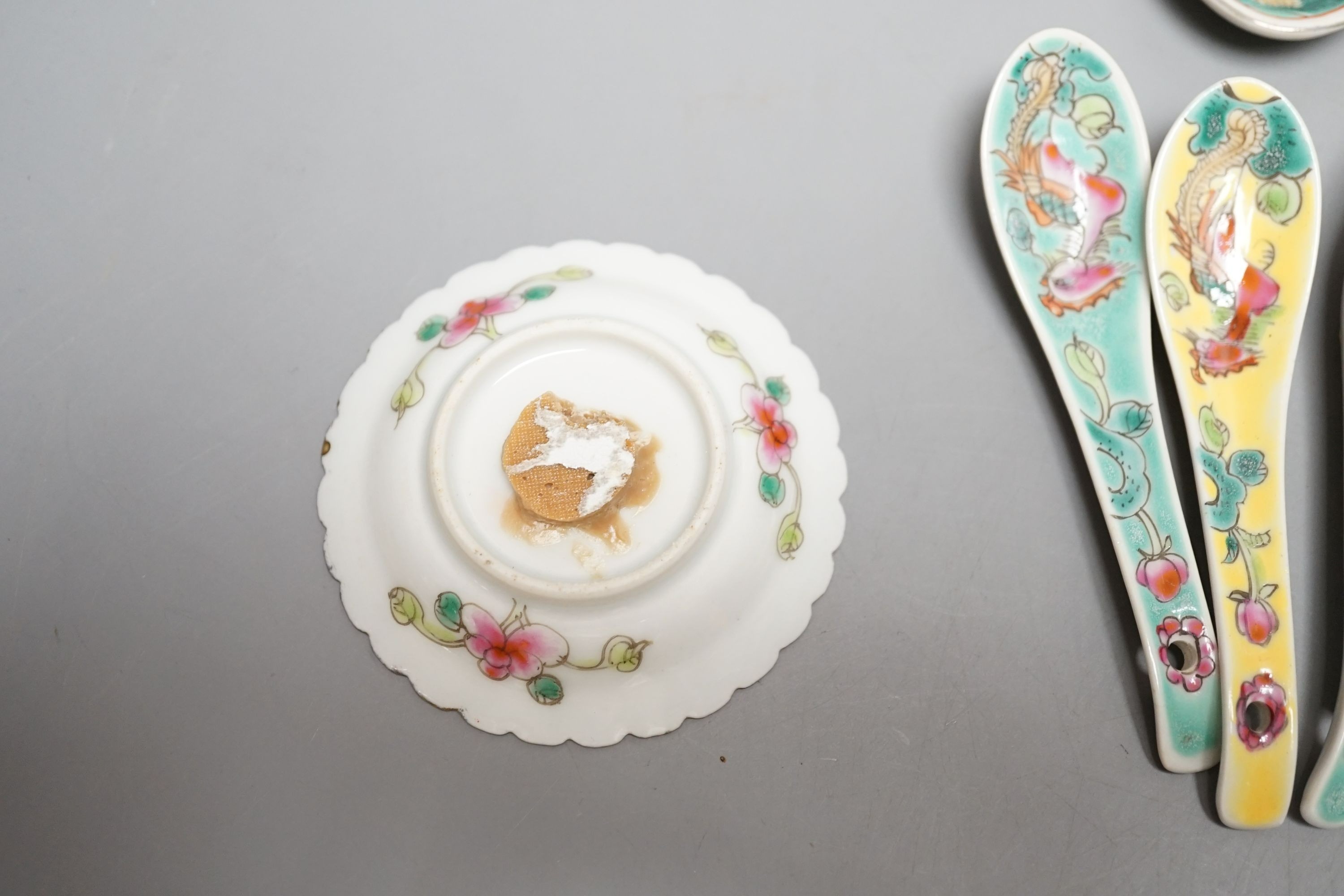 A collection of Chinese Straits porcelain spoons and a dish